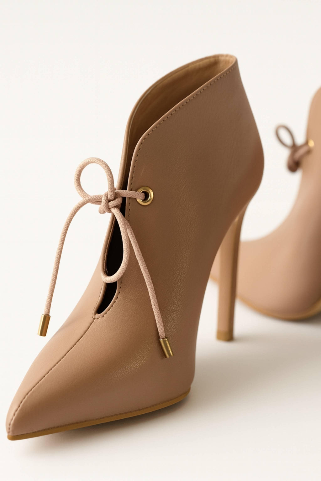 Elegant pair of Oh! Divine nude pointed-toe stiletto heels showcasing luxurious Afro-luxury craftsmanship.