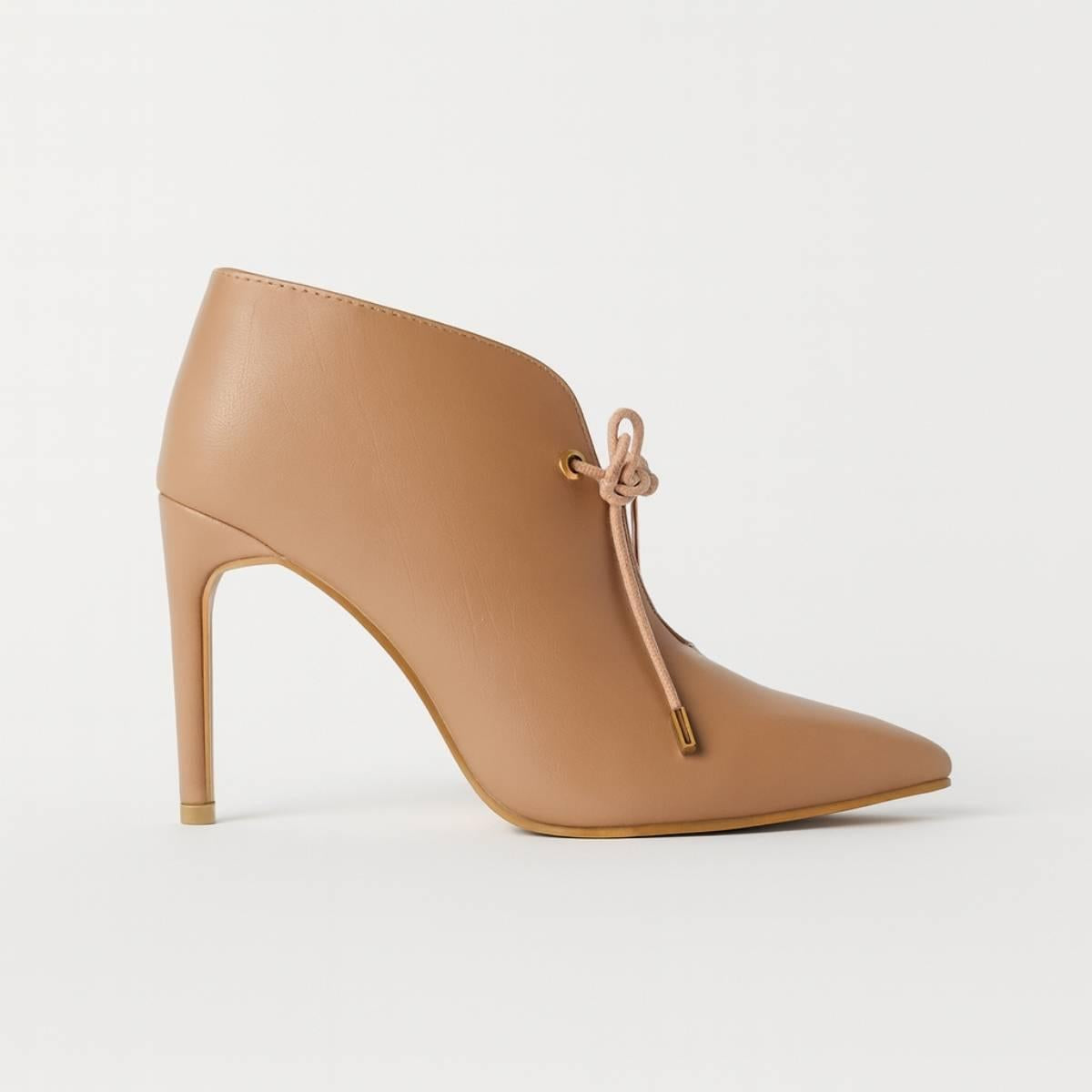 Oh! Divine nude pointed stiletto heel side profile showing refined high-heel arch and gold-accented lace tip.