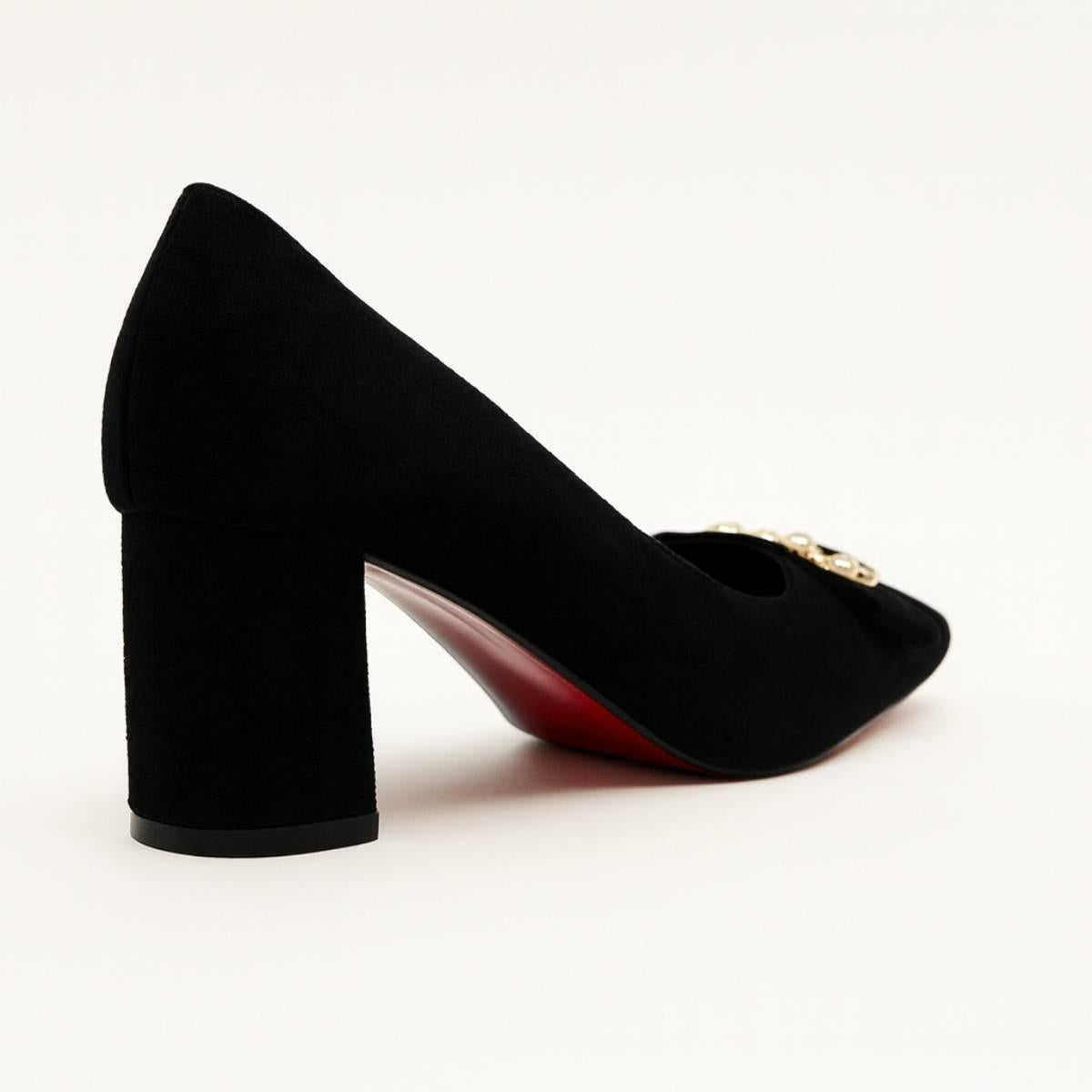 Back angle showing Amara Noir Chain Block Heels with smooth block heel design.