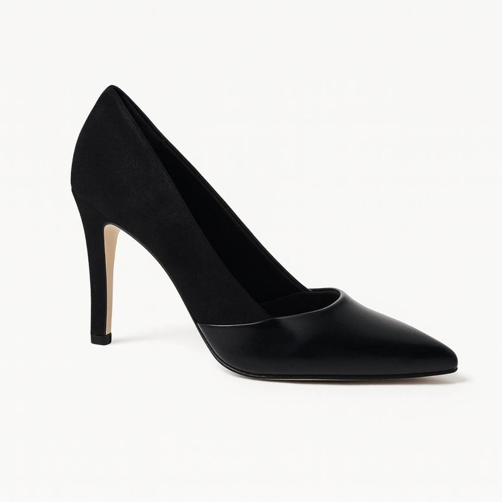 Angled view of Oh! Divine Aria Noir black stiletto pump showing sleek heel and polished leather-suede contrast.