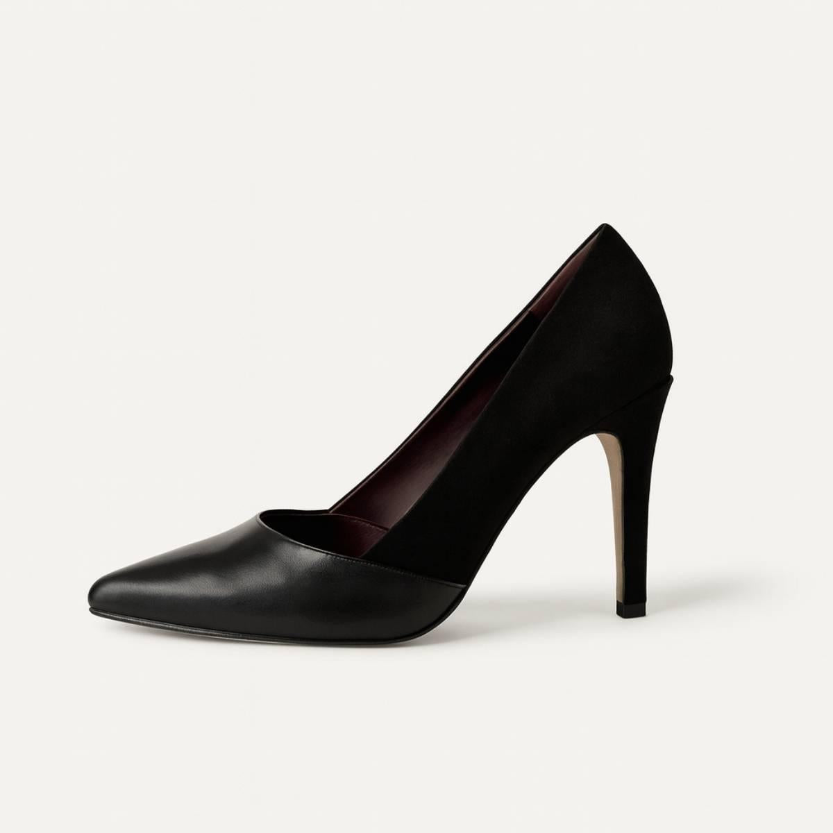 Side profile of Oh! Divine Aria Noir women’s stiletto heel, black faux leather pump with soft suede upper.