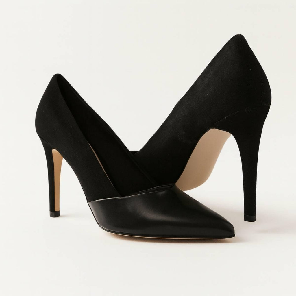Close-up of Oh! Divine Aria Noir black heel highlighting soft suede texture and fine stiletto detailing.