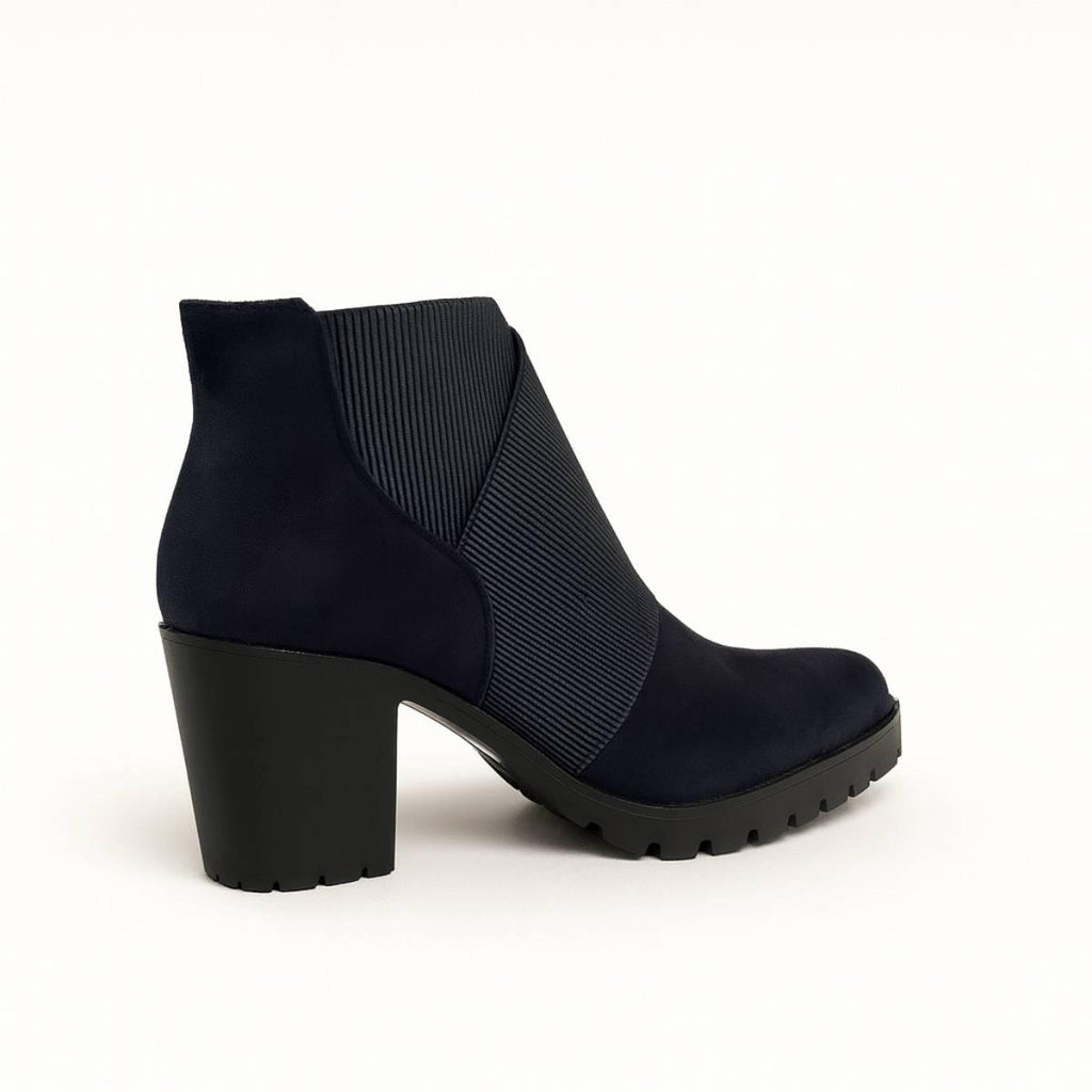 Back angled view of Celeste Navy Block Heel Ankle Boots showing ribbed stretch panel design.
