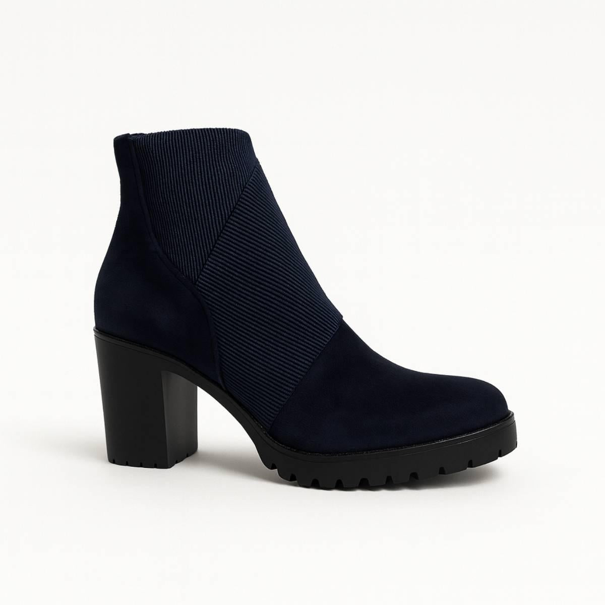 Close-up of Celeste Navy Block Heel Ankle Boots showing smooth suede and ridged detailing.