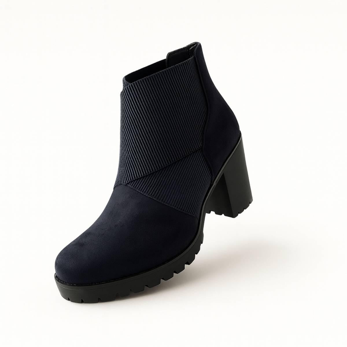 Front angled view of Celeste Navy Block Heel Ankle Boots highlighting textured ribbed panel.