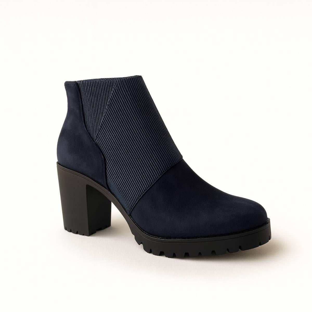 Studio front view of Celeste Navy Block Heel Ankle Boots showcasing cross-ribbed texture.