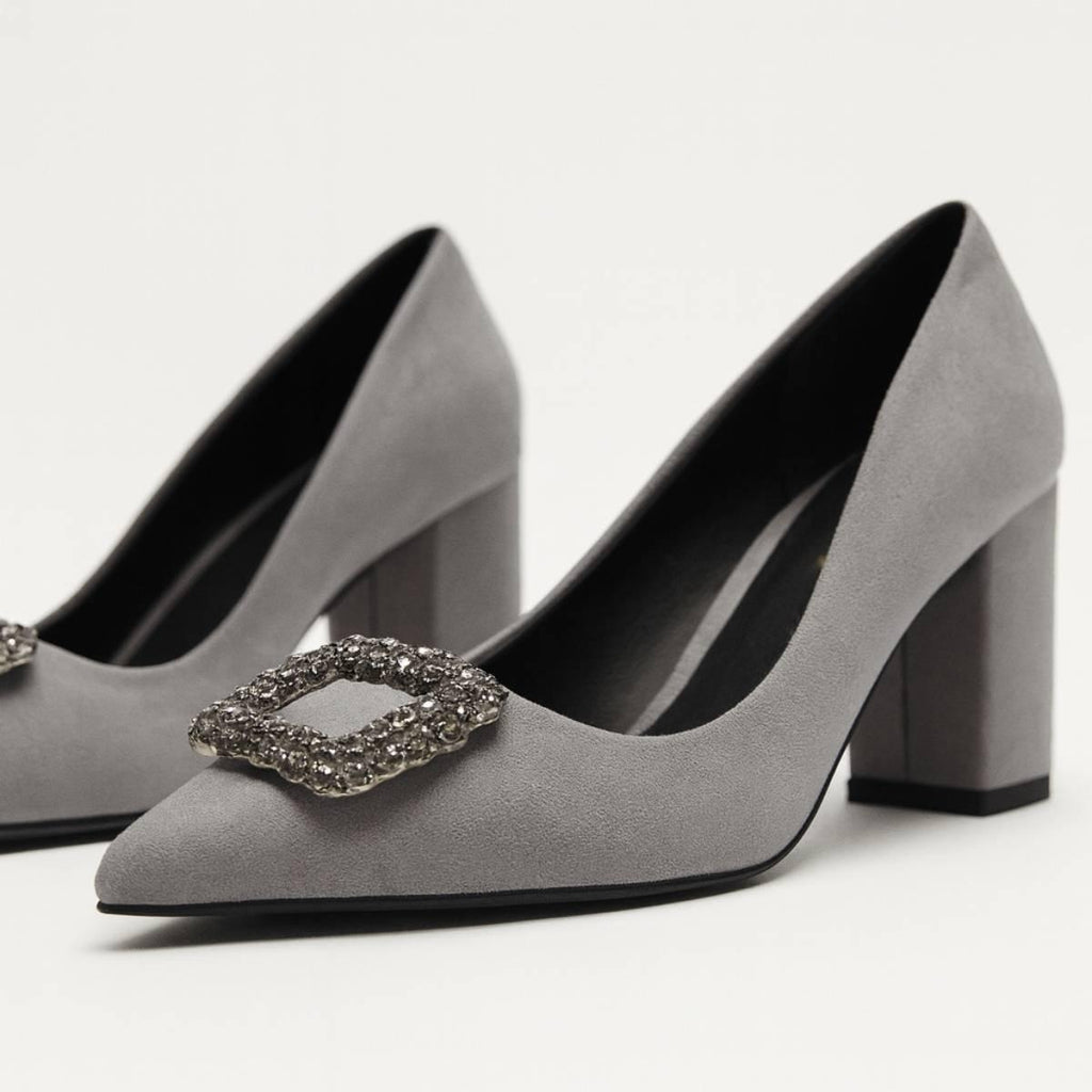 Close-up of Charcoal Grace Block Heels showing jeweled buckle and soft suede texture.
