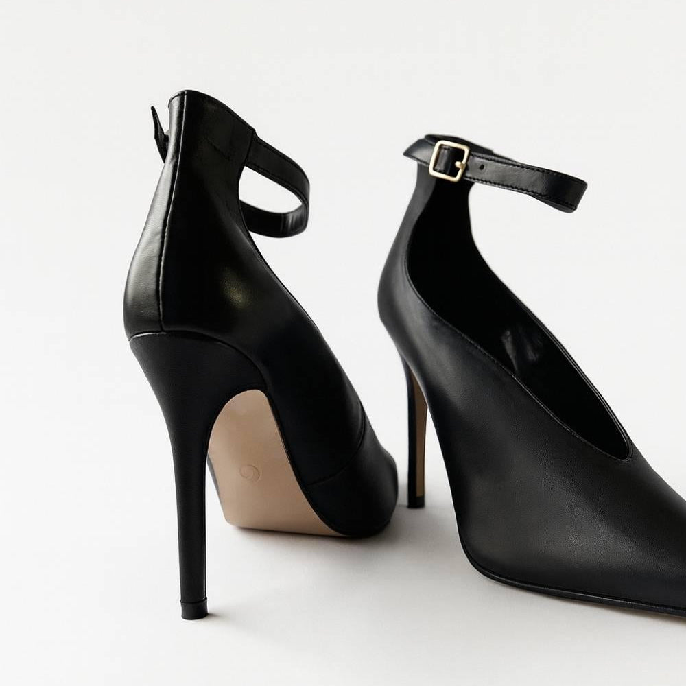 Rear angled view of Divina Ankle Grace Stilettos revealing sleek heel curve and buckle.