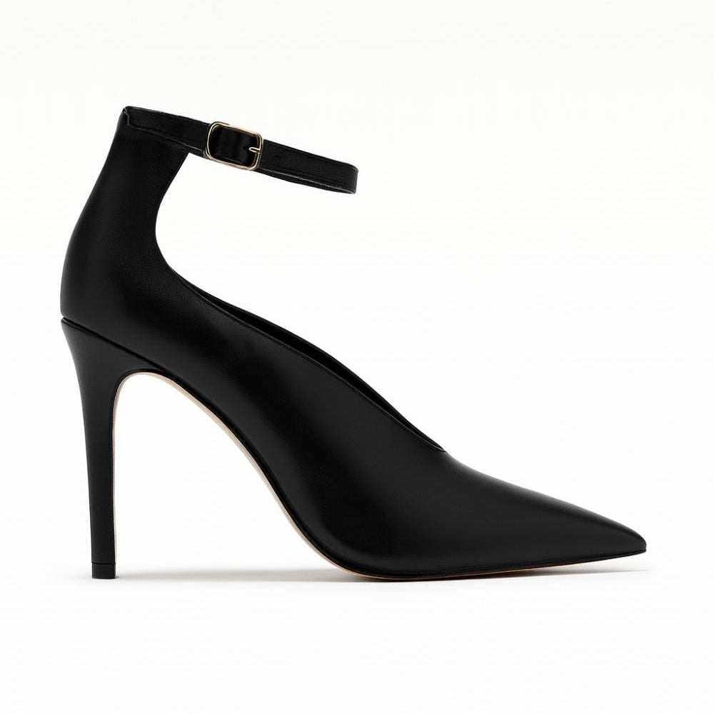 Model wearing Divina Ankle Grace Stiletto heels with brown dress for elegant evening style.