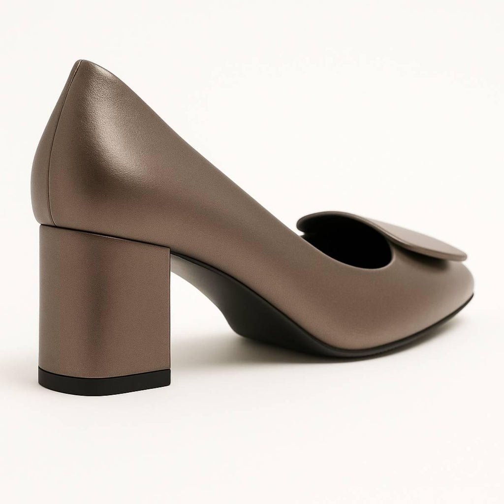 Close-up of Elara Bronze Sculpted Block Heel showing rear block heel and square front embellishment.