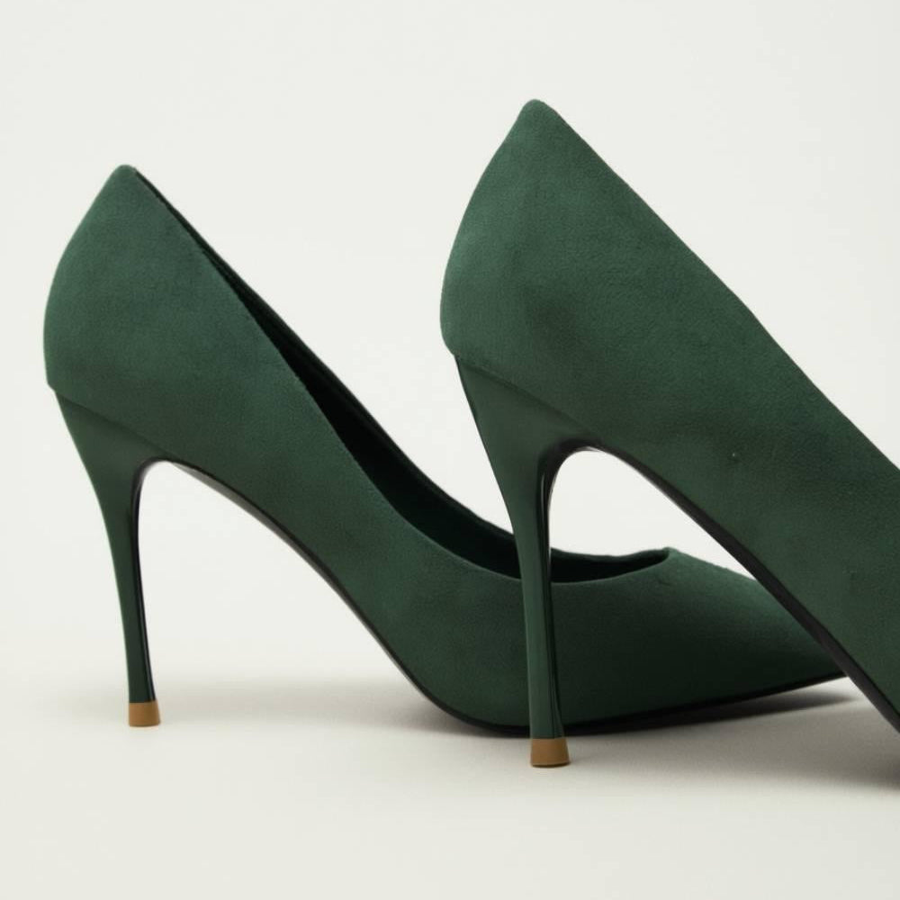 Heel detail of the Emerald Grace Stiletto in rich green suede — refined, feminine, and elegant.