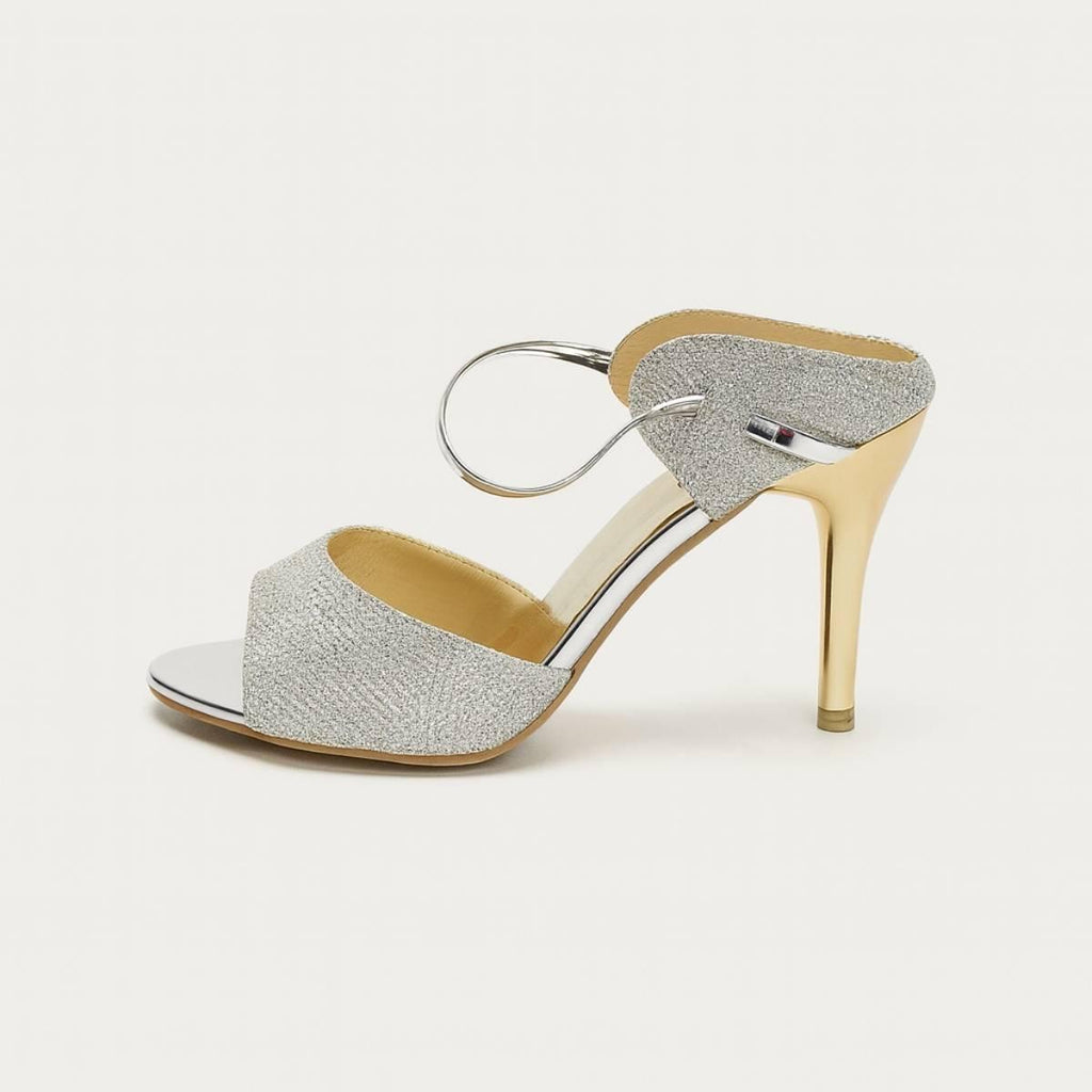 Metallic profile of Nyla Gold Radiance Stiletto Heel with elegant silver ankle strap and gold heel