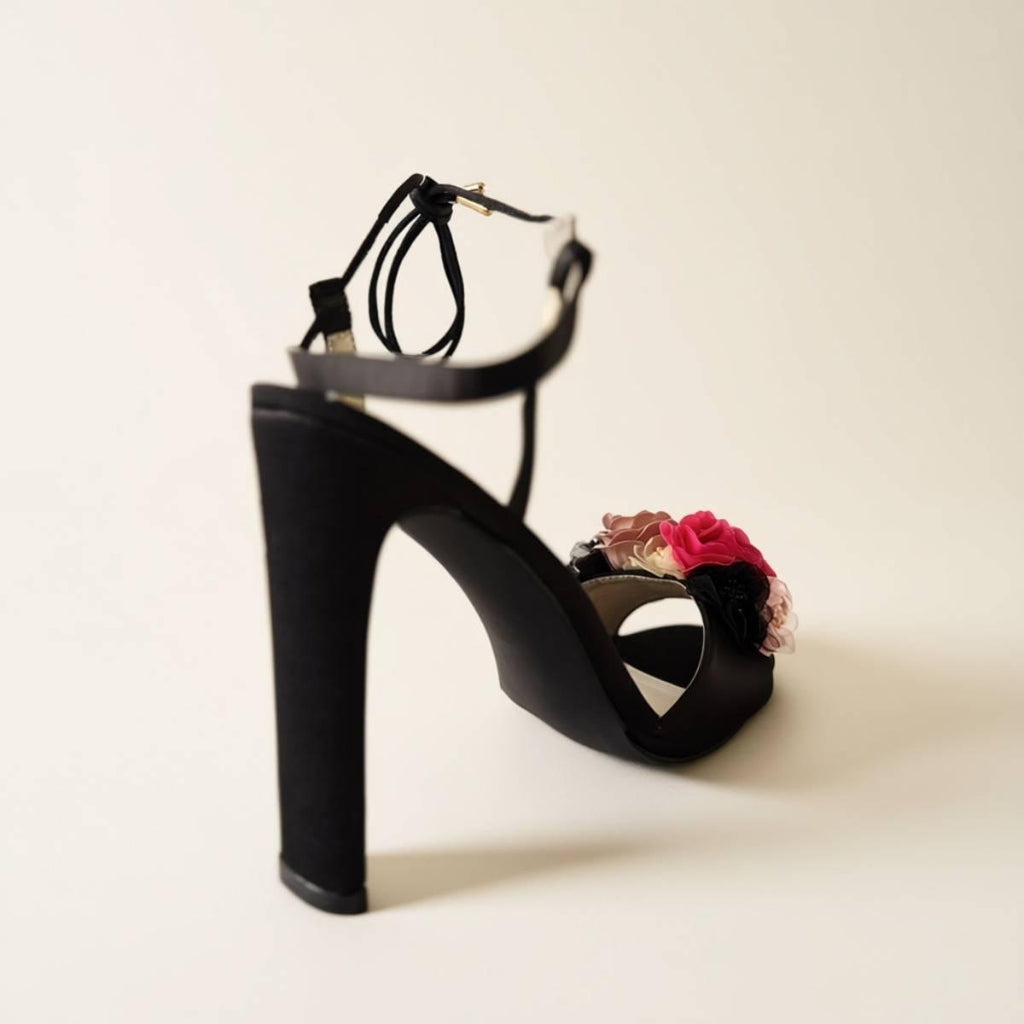 Rear angle of Oh! Divine floral black high-heel sandal showcasing sculpted heel and feminine design.