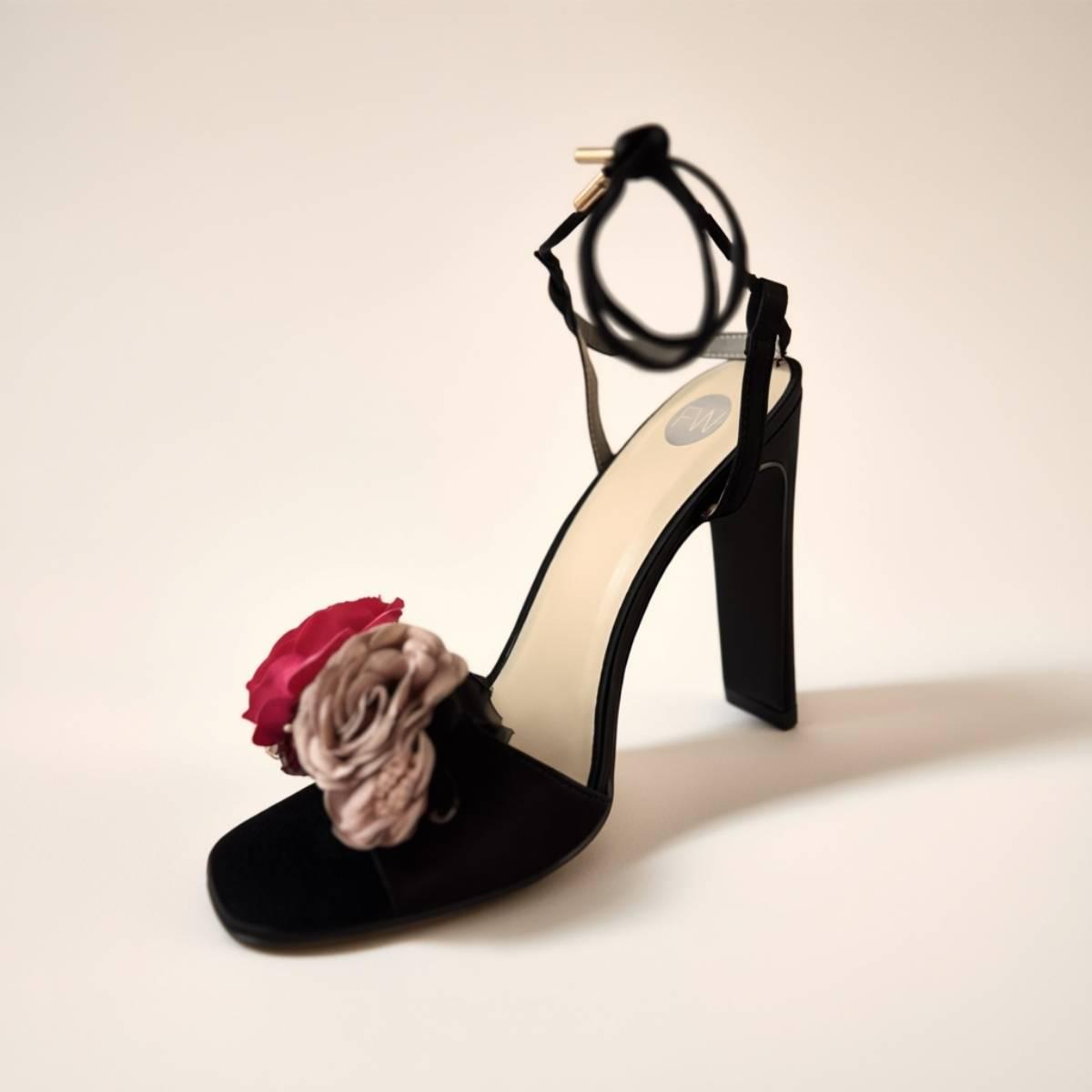 Elegant Oh! Divine black high heels with pink and beige floral accents and soft matte finish.