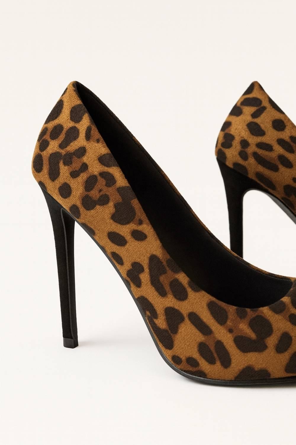 Oh! Divine Nia Wild Grace leopard print stilettos with pointed-toe design and high stiletto heel, radiating confidence and sophistication.