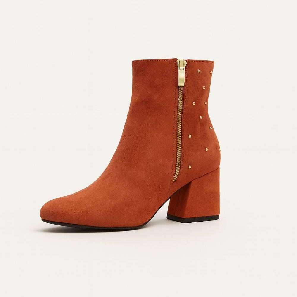 Front angled view of Studded Block Heel Ankle Boot in rust suede with block heel and stud accents