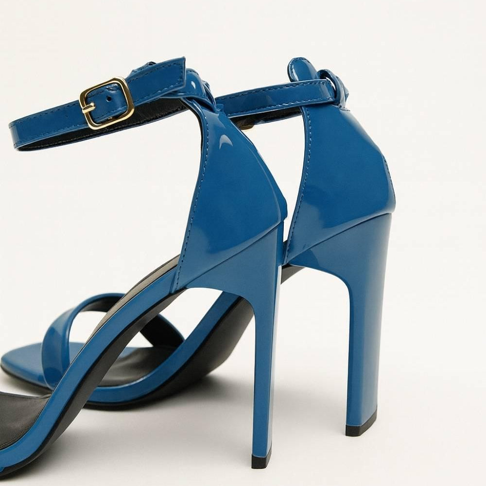 Flat lay of Valentina Cobalt Blue Heels emphasizing the sleek design, squared toe, and glossy finish