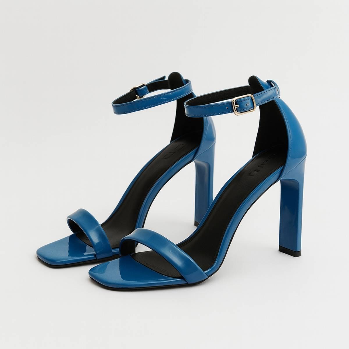 Pair of Valentina Cobalt Blue Ankle-Strap Heels in glossy patent faux leather with minimalist single strap design